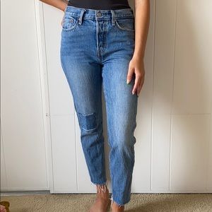 Levi’s button fly size 27 distressed jeans